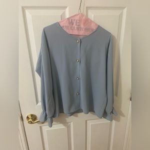 Blue flowy blouse with gold pearl button detail